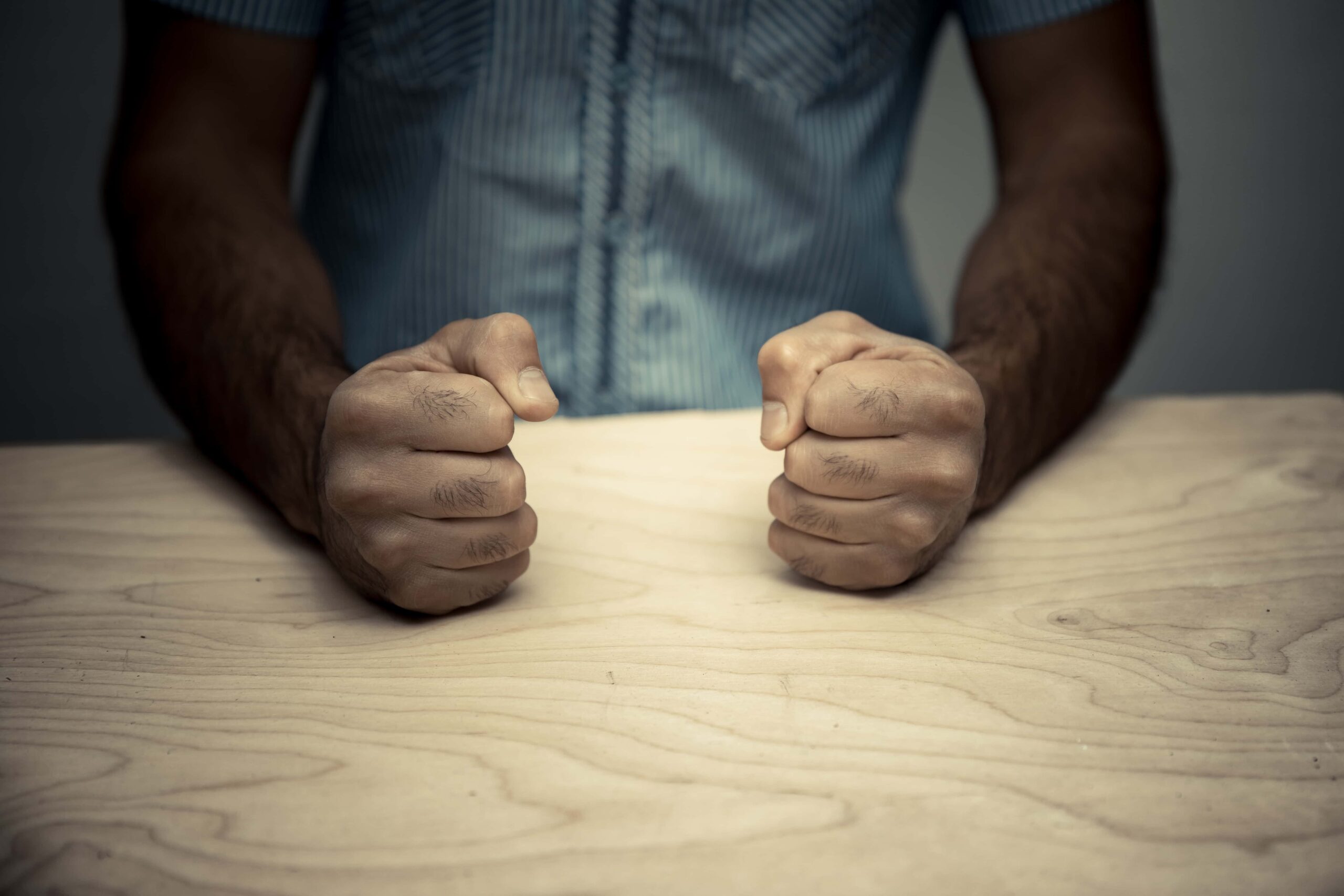 Male in police interrogation room angry