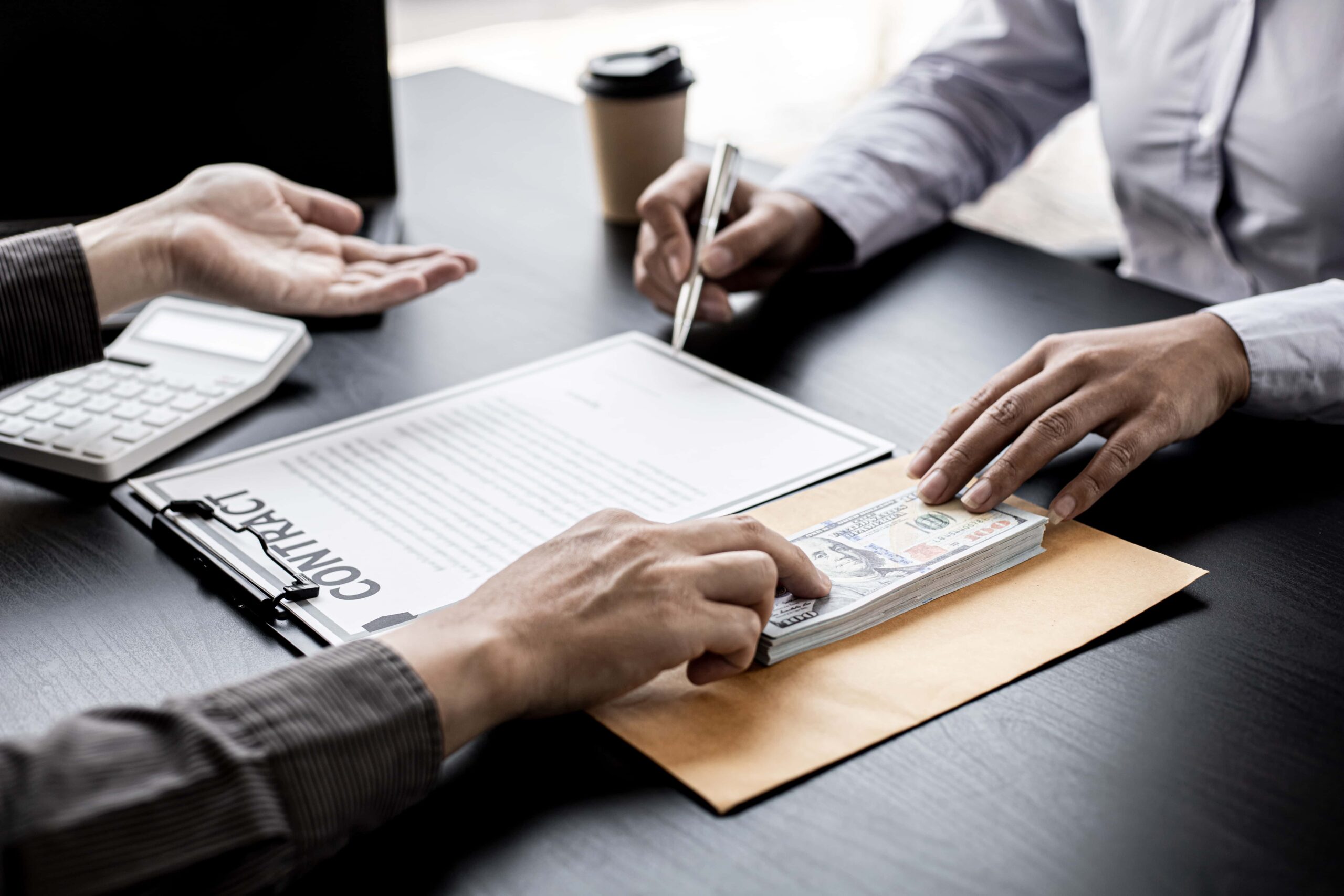 Procurement manager accepting bribe money from a partner company as part of a fraudulent scheme, highlighting the illegal and unethical nature of corporate fraud