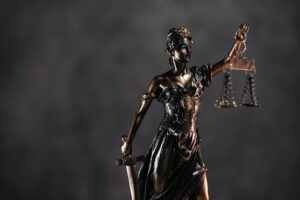Lady Justice statue symbolizing fairness and balance, representing the importance of transparency and reasonableness in legal fees