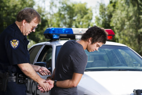 Nassau County resident being arrested illustrating the need to understand the arrest process in Nassau County